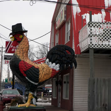 big cock / rooster statue in front of Carl's Bakery, Cafe and Catering in East Peoria, IL
